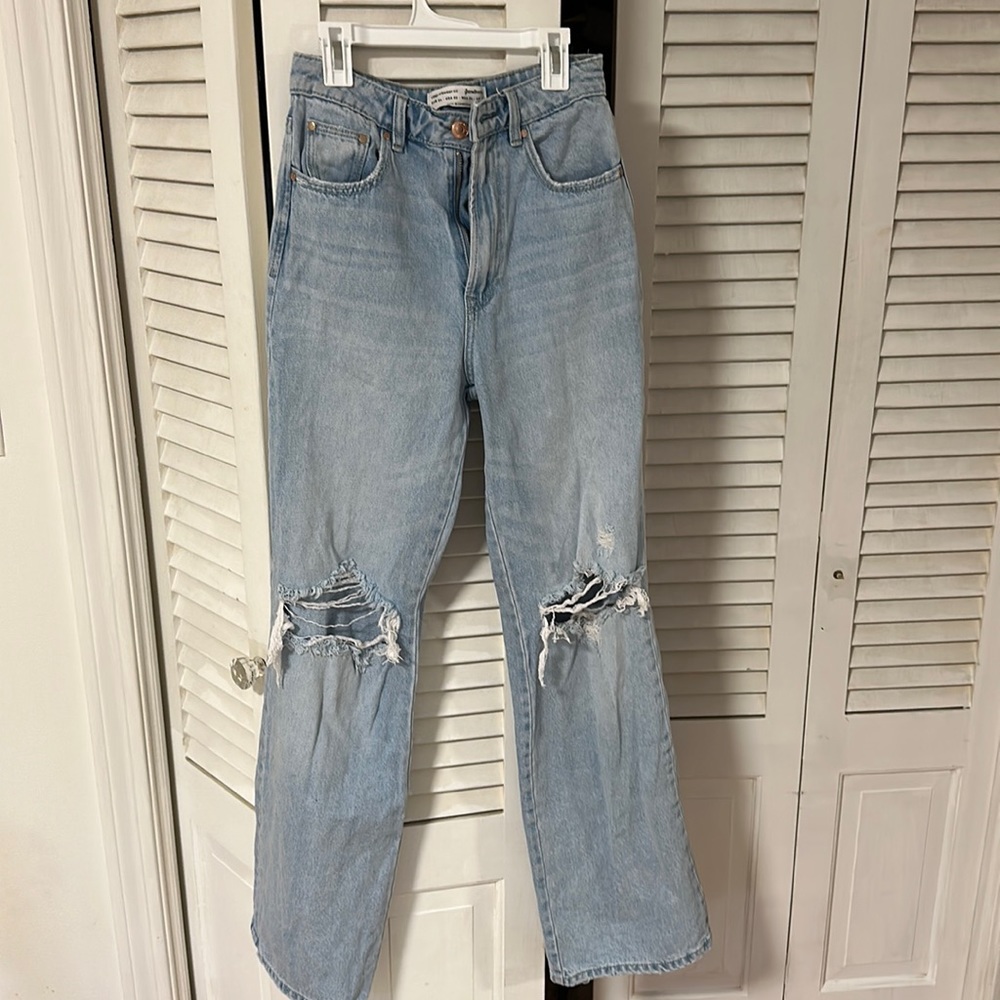 Stradivarius blue, ripped, straight jeans. USA 2; EUR 34.